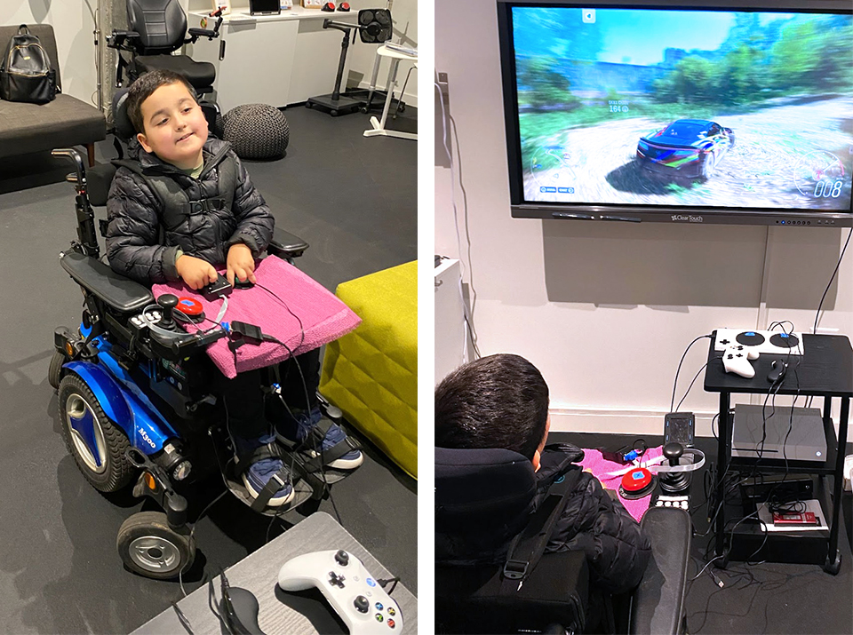 A young boy in a wheelchair playing a video game using assistive technology