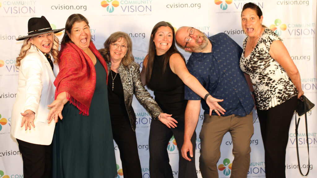 A group of friends strike playful poses